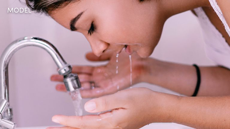 Model cleansing her skin
