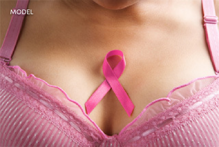 Pink Ribbon On Women's Chest with a Pink Bra